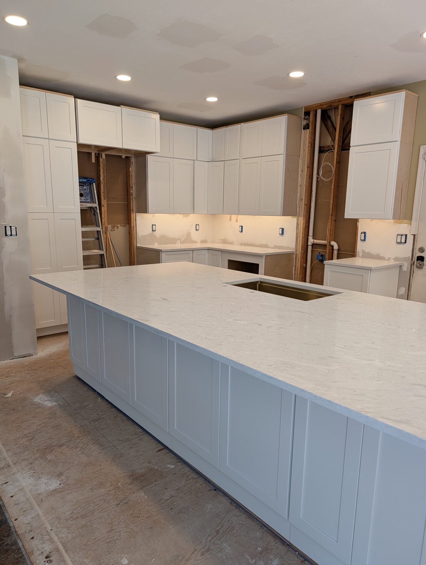 Quartz countertop installed on new kitchen island during Montgomery County remodel