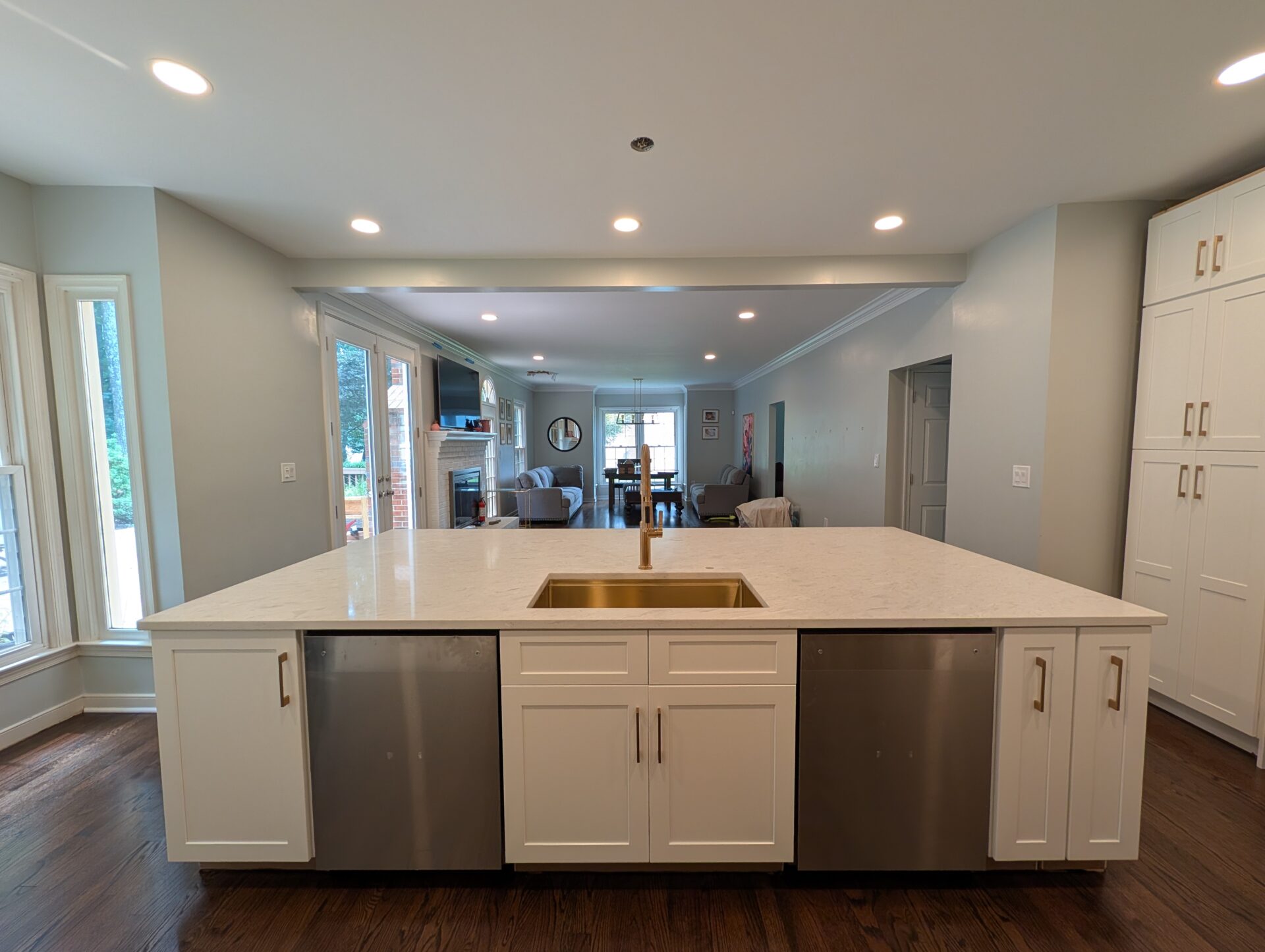 Kitchen opened through to living room after load-bearing wall removal in Montgomery County MD