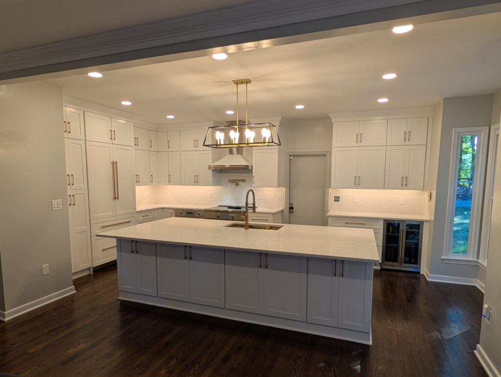 rockville md kitchen remodel finished TCO Handyman Renovation Services Central Maryland Finished Rockville kitchen remodel with white shaker cabinets to the ceiling and a large island with gold faucet